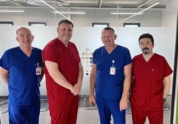 Doctors in blue and red scrubs